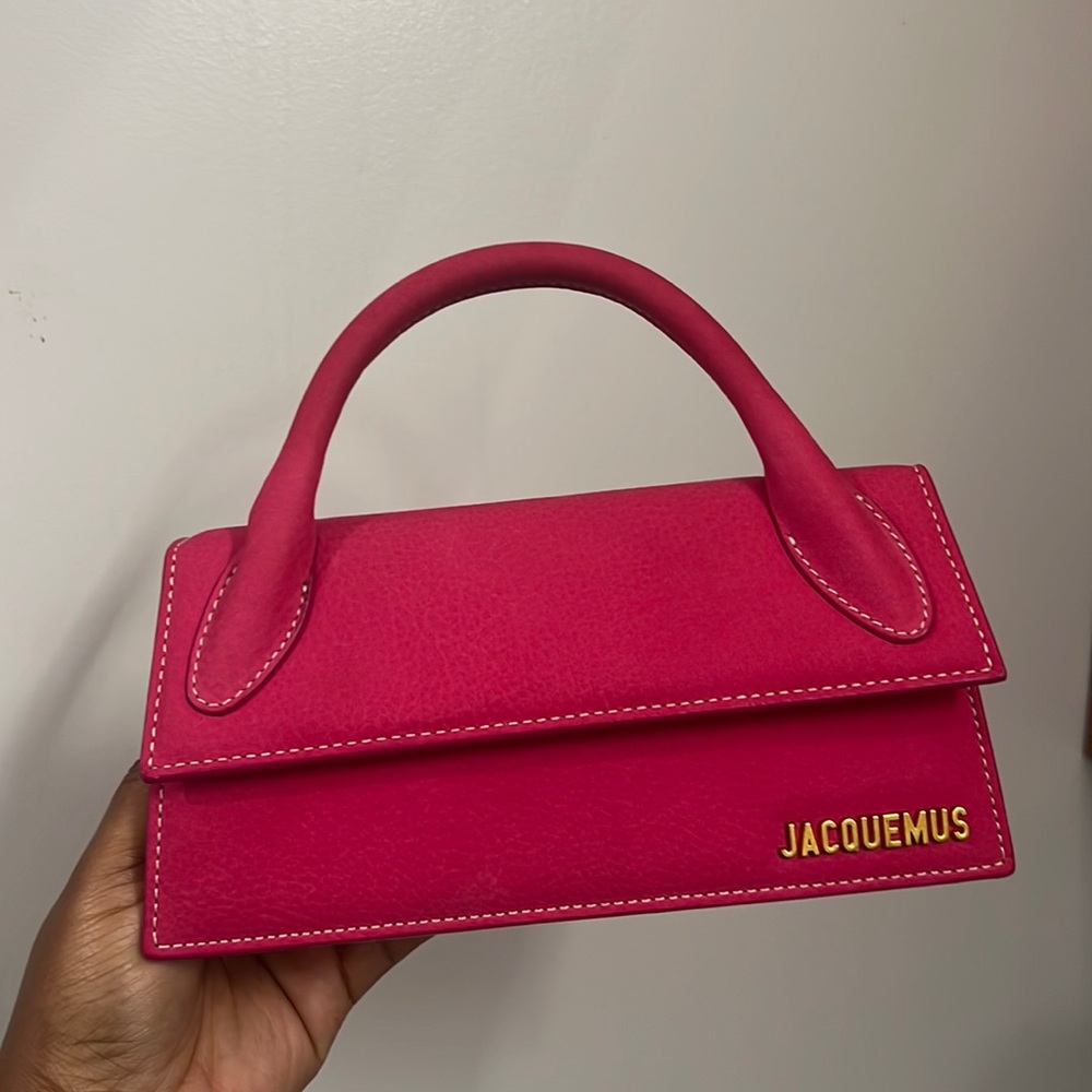 JACQUEMUS
Pink Long 'Le Chiquito' Clutch like brand new used once! With Dust Bag